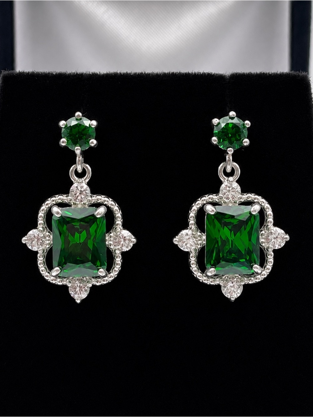 Gorgeous 10.4ctw Emerald Cut Emerald Earrings White Sapphire Accents